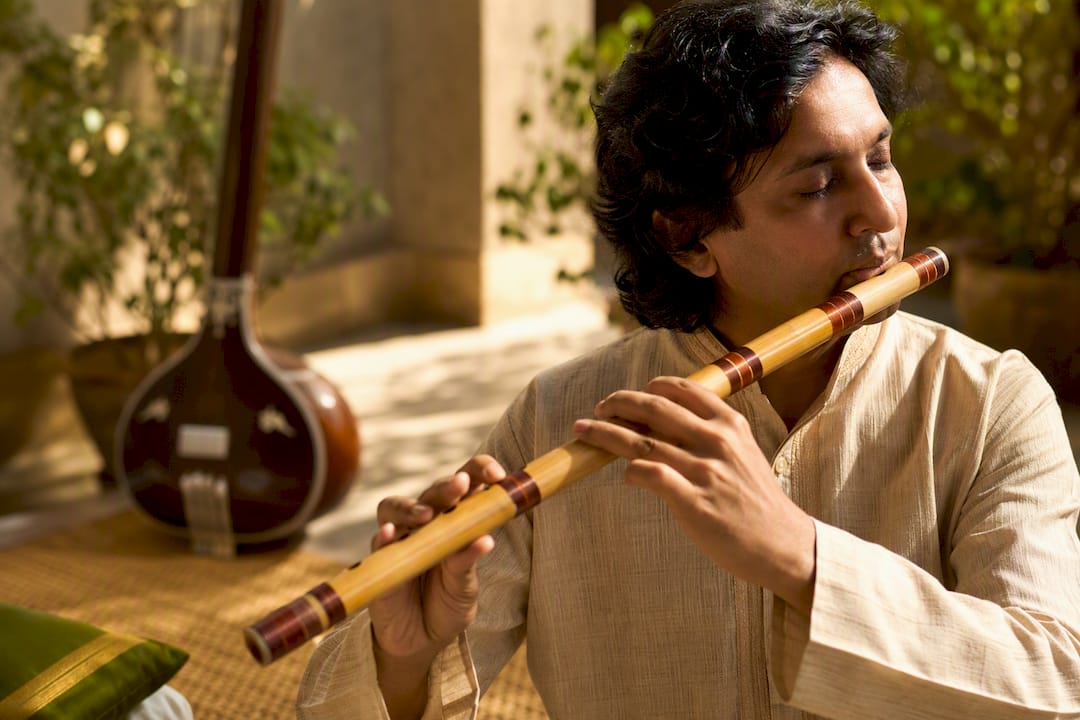 Bansuri player controlling breath and fingers