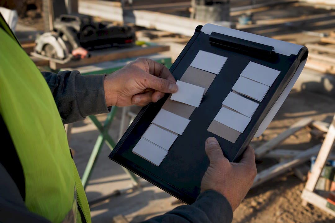 Hands arranging labor and subcontractor line items