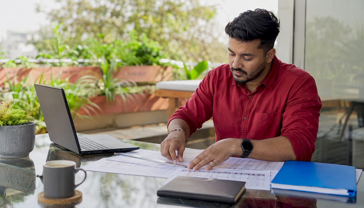 Hands arranging rota and attendance logs