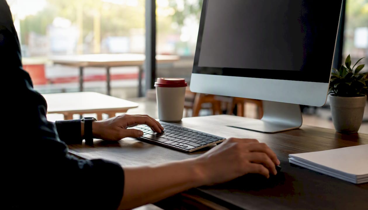 Hands using office computer peripherals