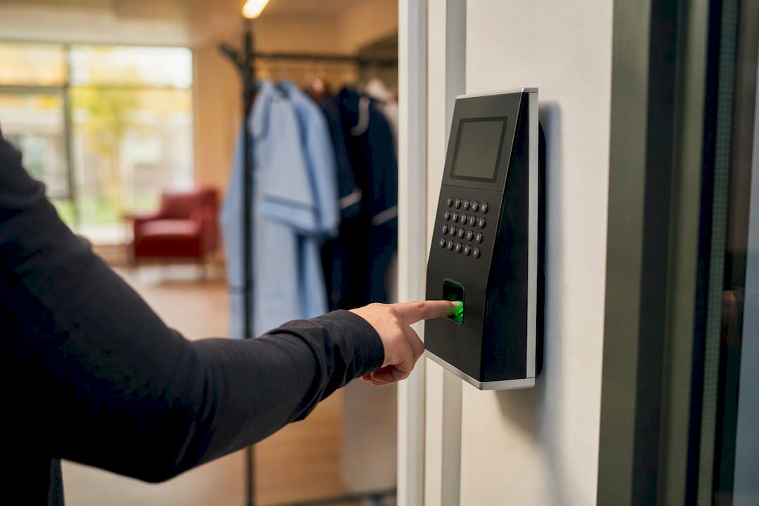 Finger on biometric fingerprint scanner terminal