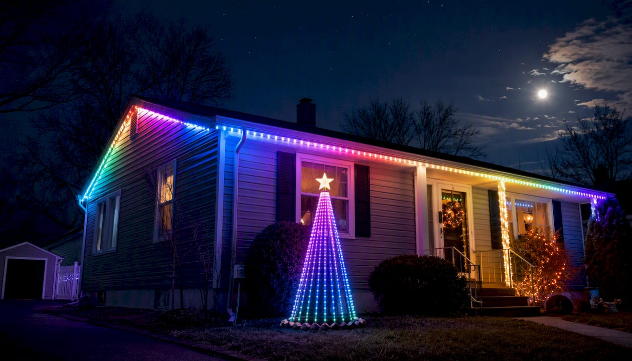 Animated pixel lights glowing on house roofline