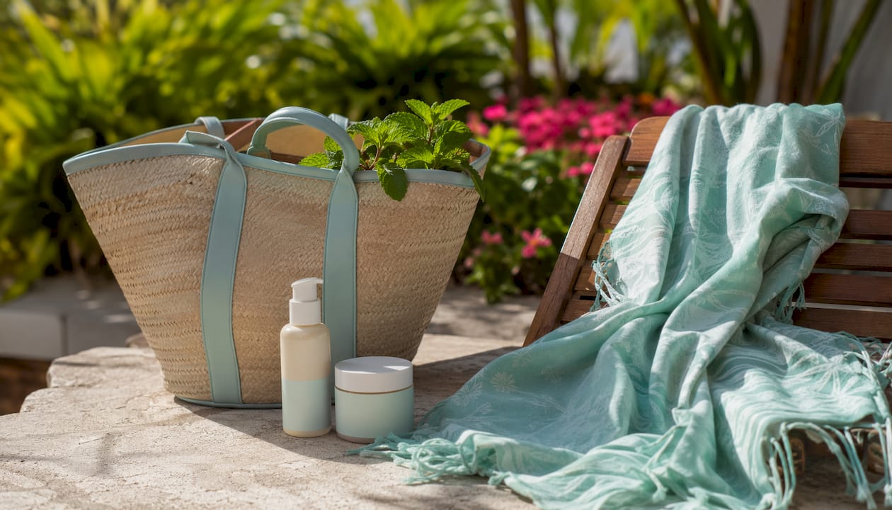 Flat lay of sunscreen and body care items