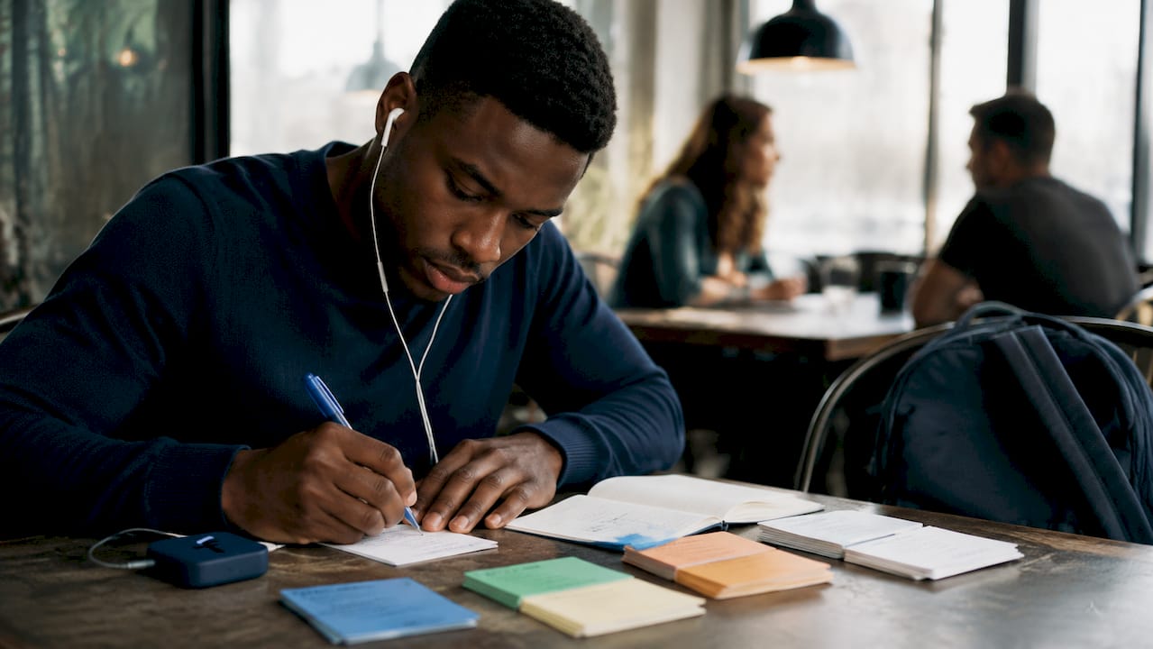 Student reviewing flashcards while listening