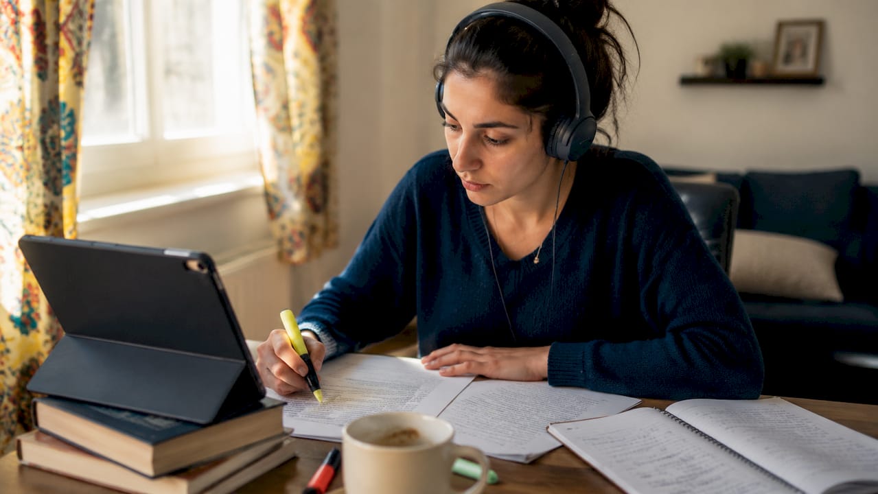 Woman listening attentively while studying French