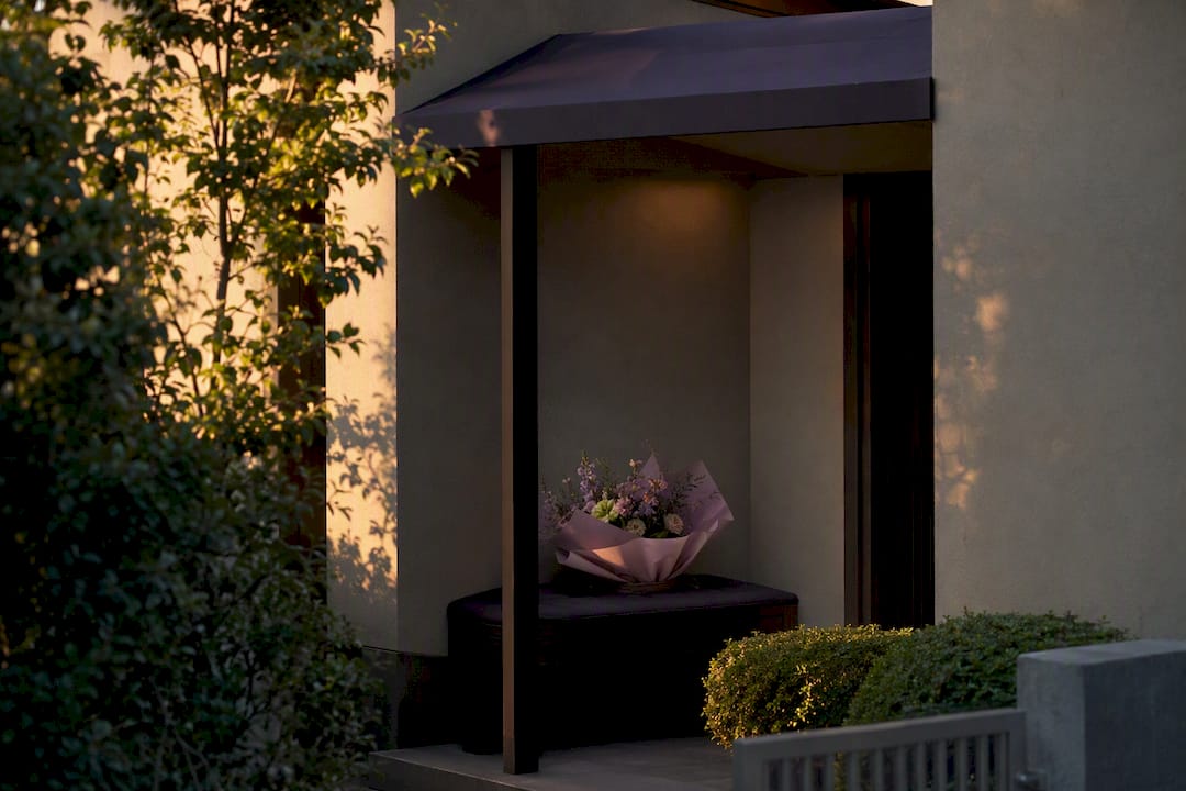 Flower arrangement in a secure alternative drop-off spot outdoors