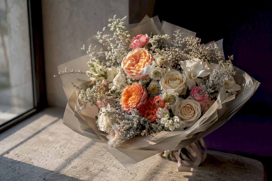 Balanced bouquet with vibrant and neutral flowers