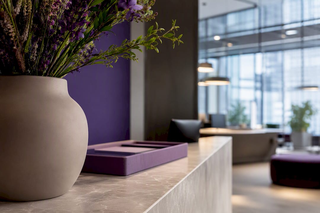 Cropped reception flowers in ceramic vessel