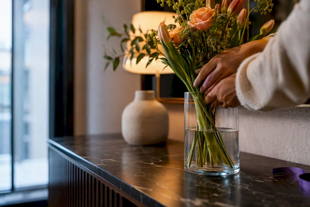 Seasonal flowers being arranged for gratitude