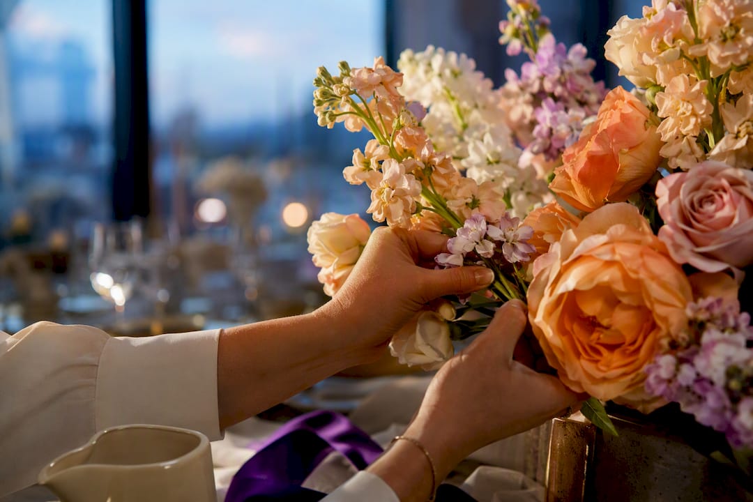 Partial warm Eid flower arrangement on table