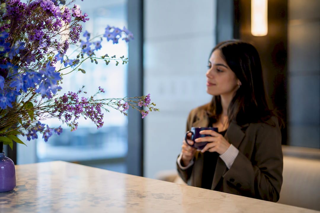 Flowering stems in a contemporary office