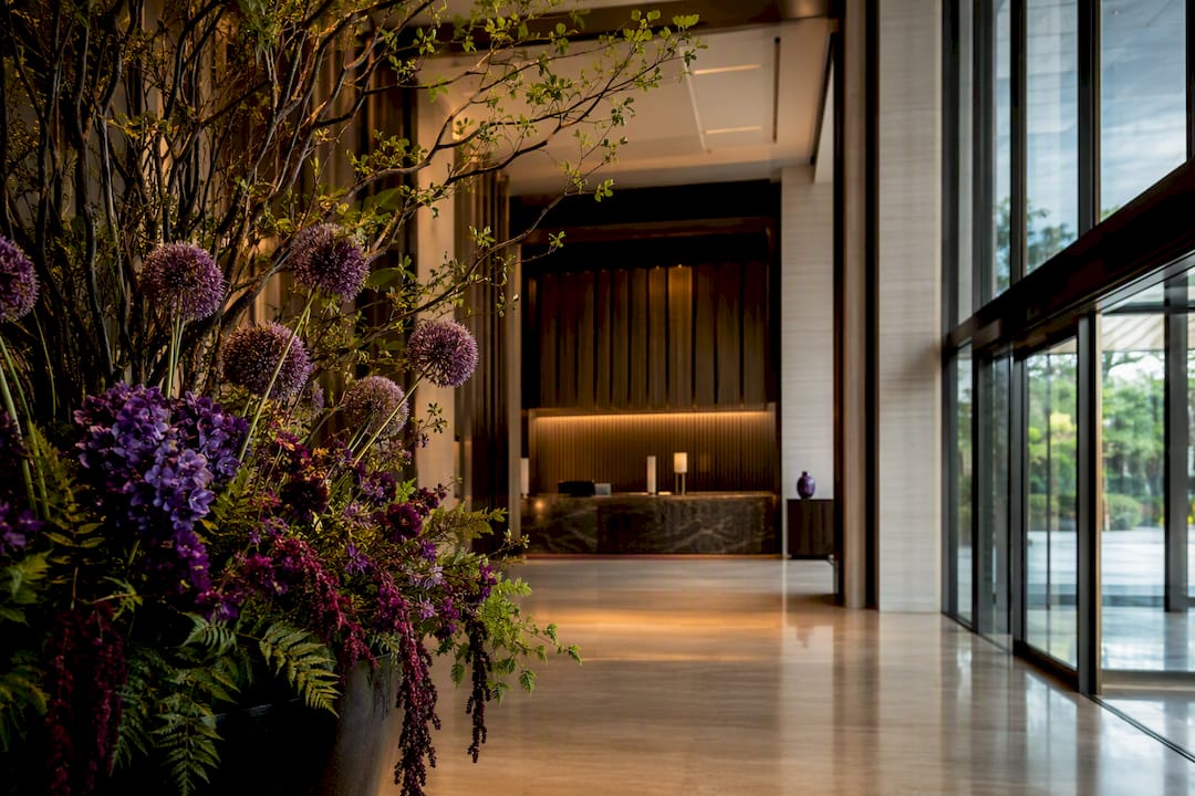 Sculptural flowers defining a hotel arrival hall