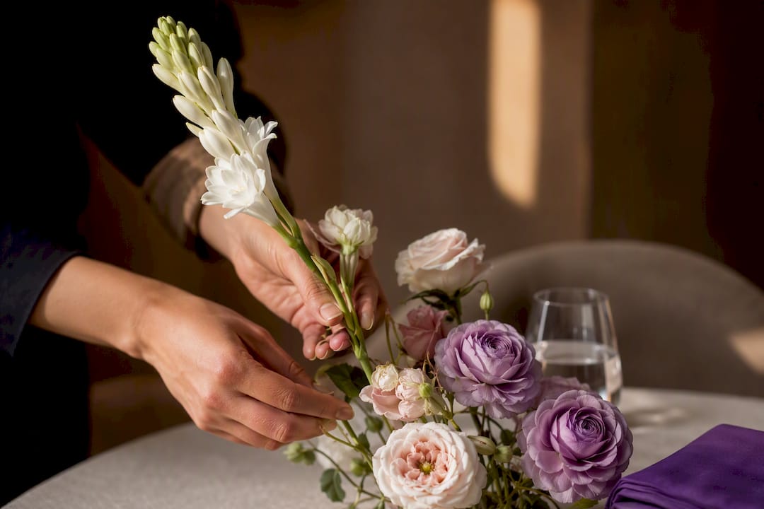 Low-scent flowers beside single tuberose stem