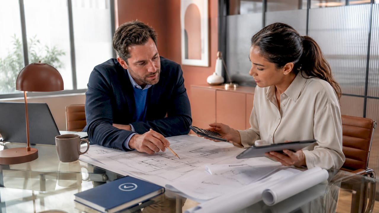 Architect and engineer coordinating plans