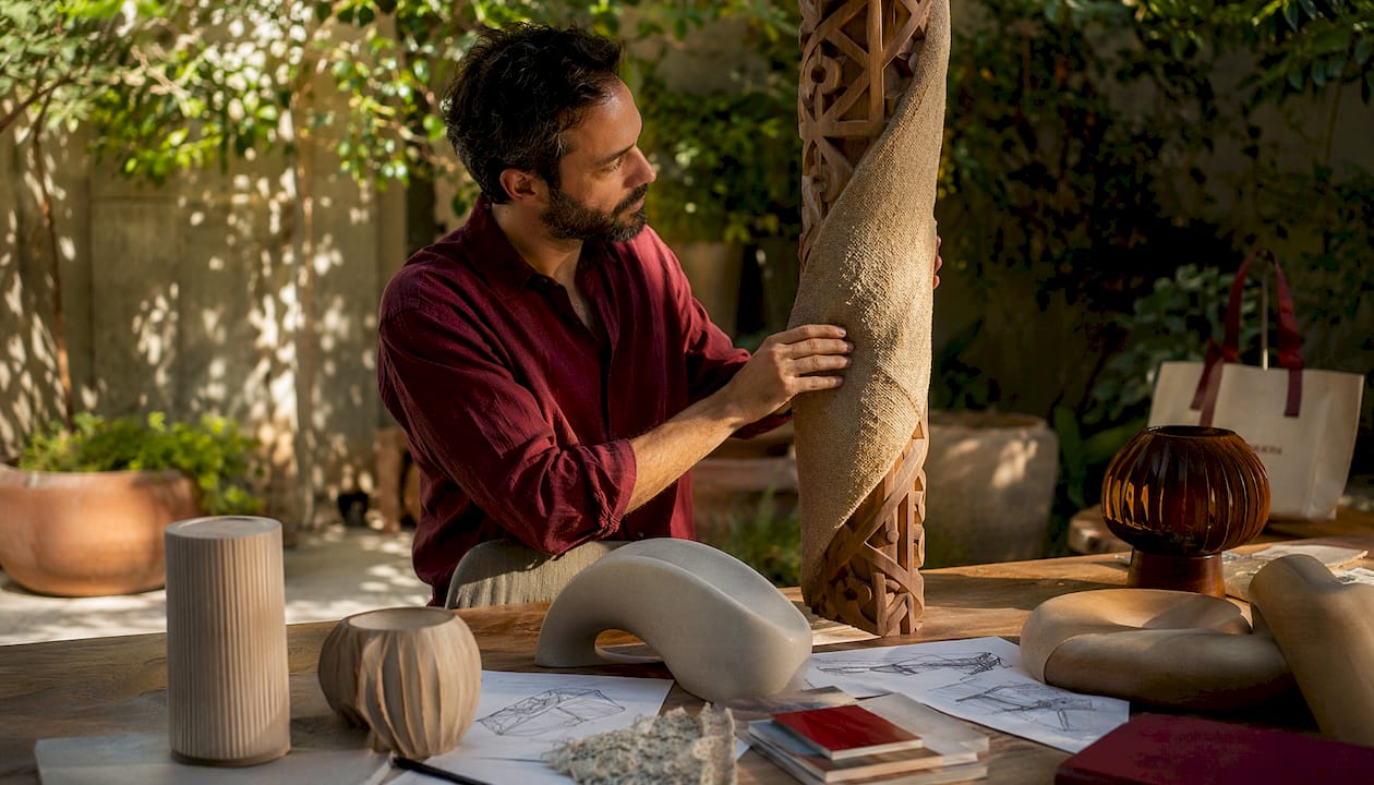 Designer inspecting organic materials in modern home
