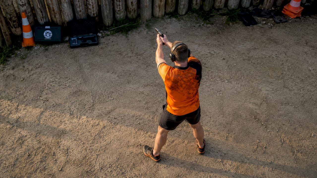 Male beginner practicing stable pistol shooting stance
