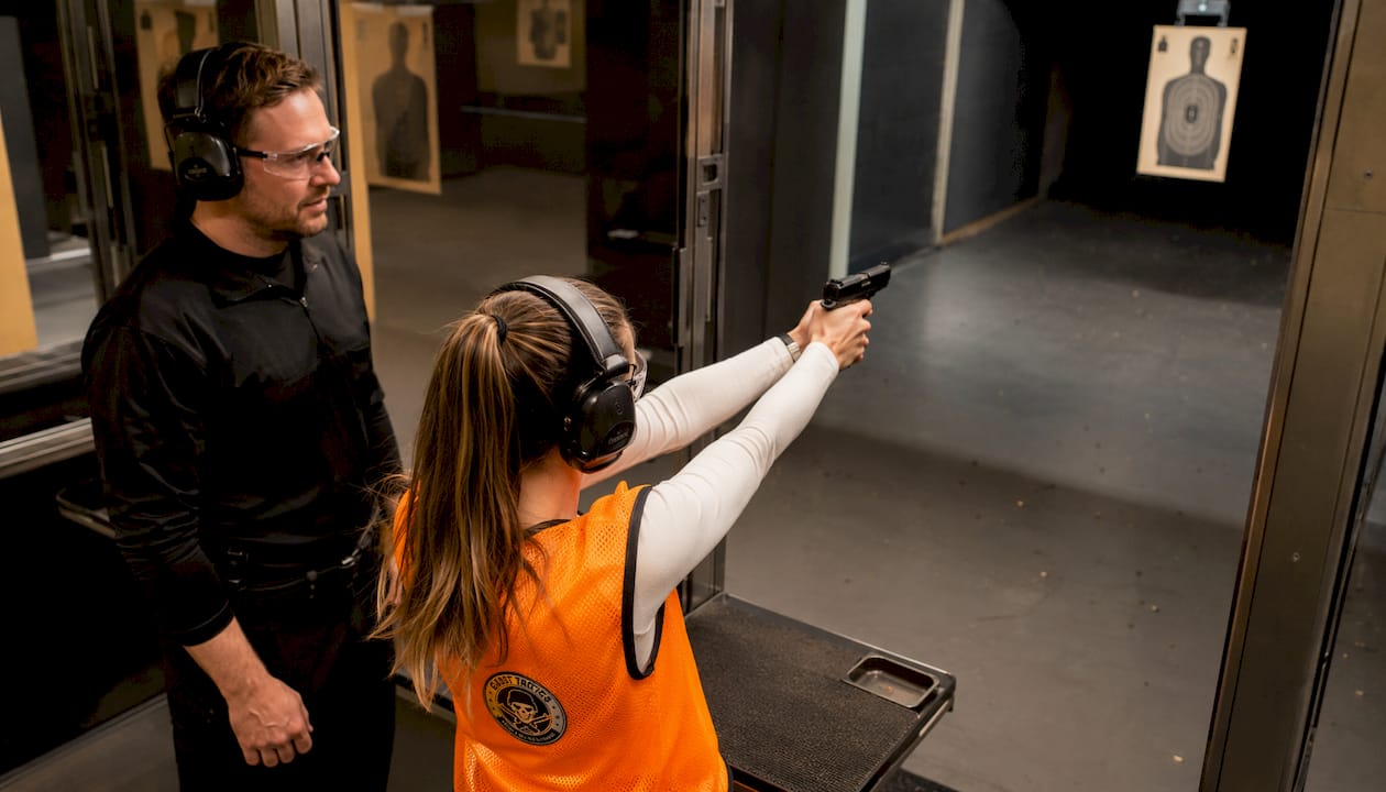 Woman practicing controlled pairs drill in lane