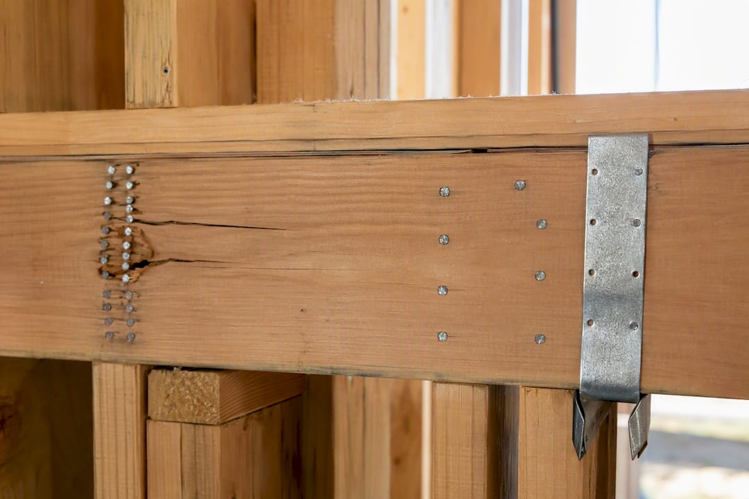 Split rim joist beside staggered nailing detail