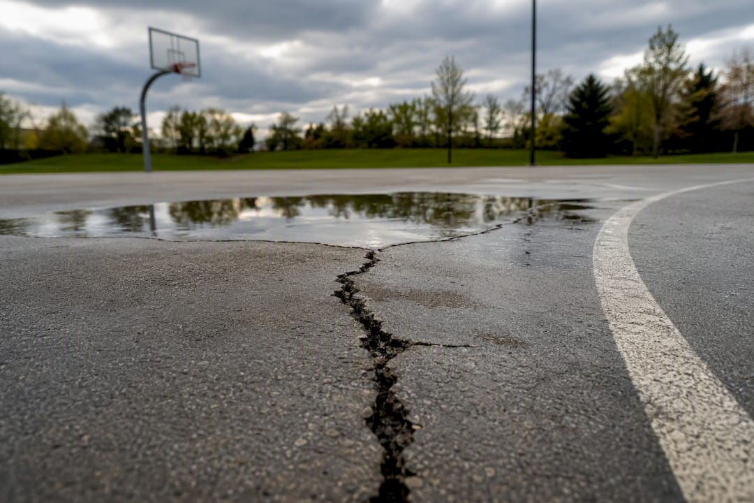 Crack and puddle on outdoor court