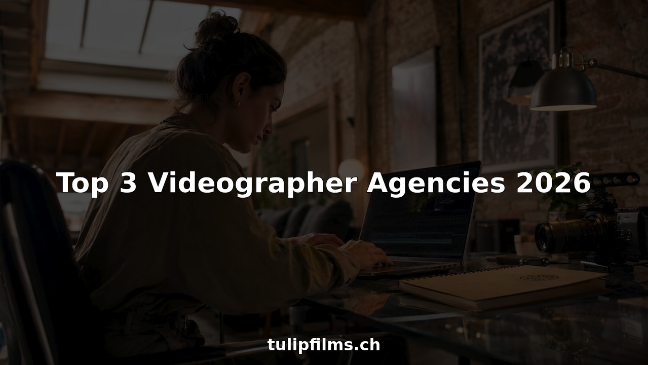 Videographer editing video footage at desk in studio