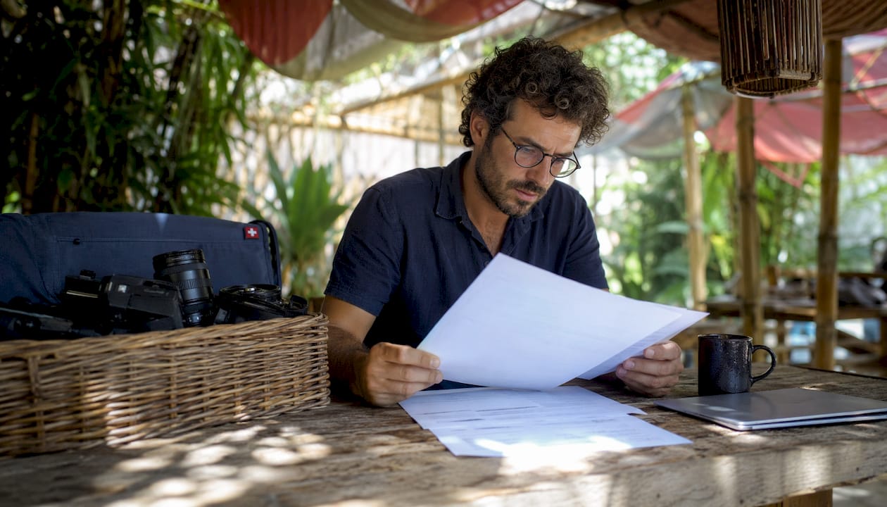 Film producer reviewing rental documents