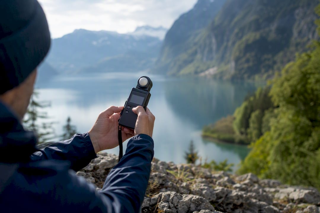 Location scout measuring light at Swiss heritage site