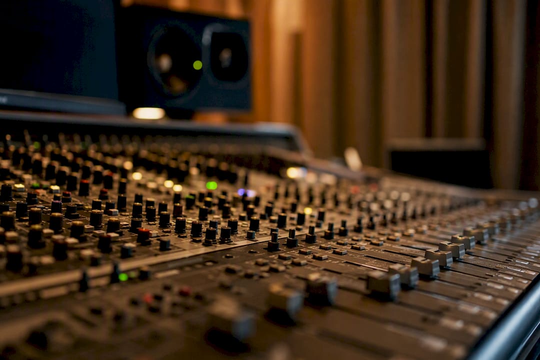 Close-up of audio mixing controls in studio