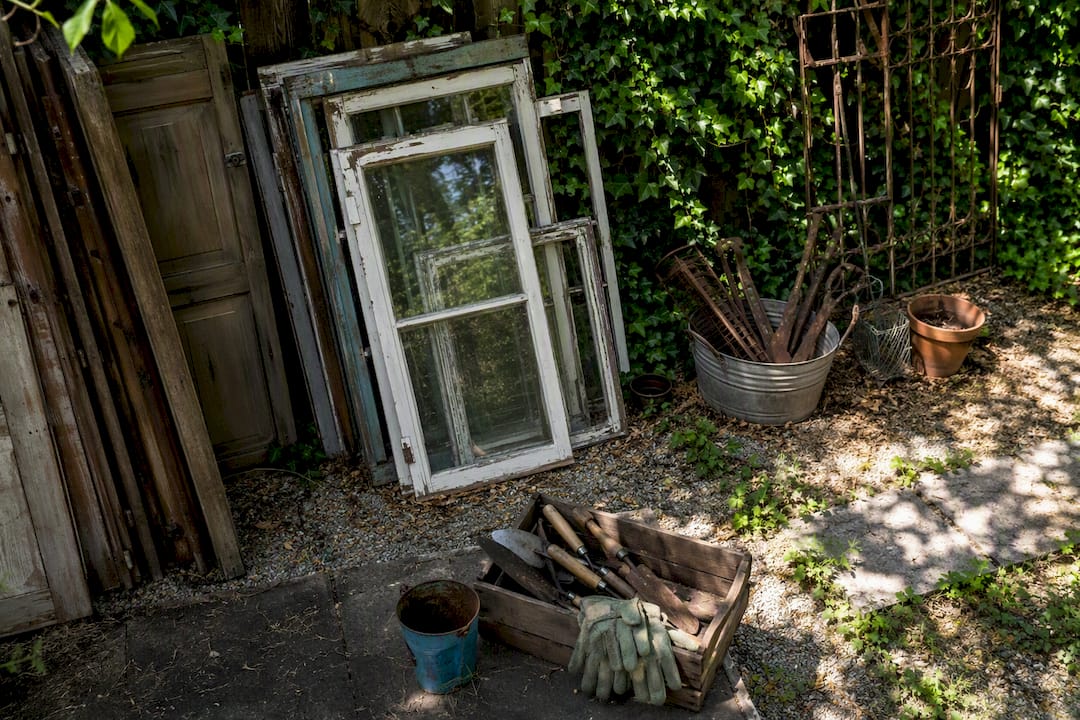 Reclaimed windows and framing materials for greenhouse