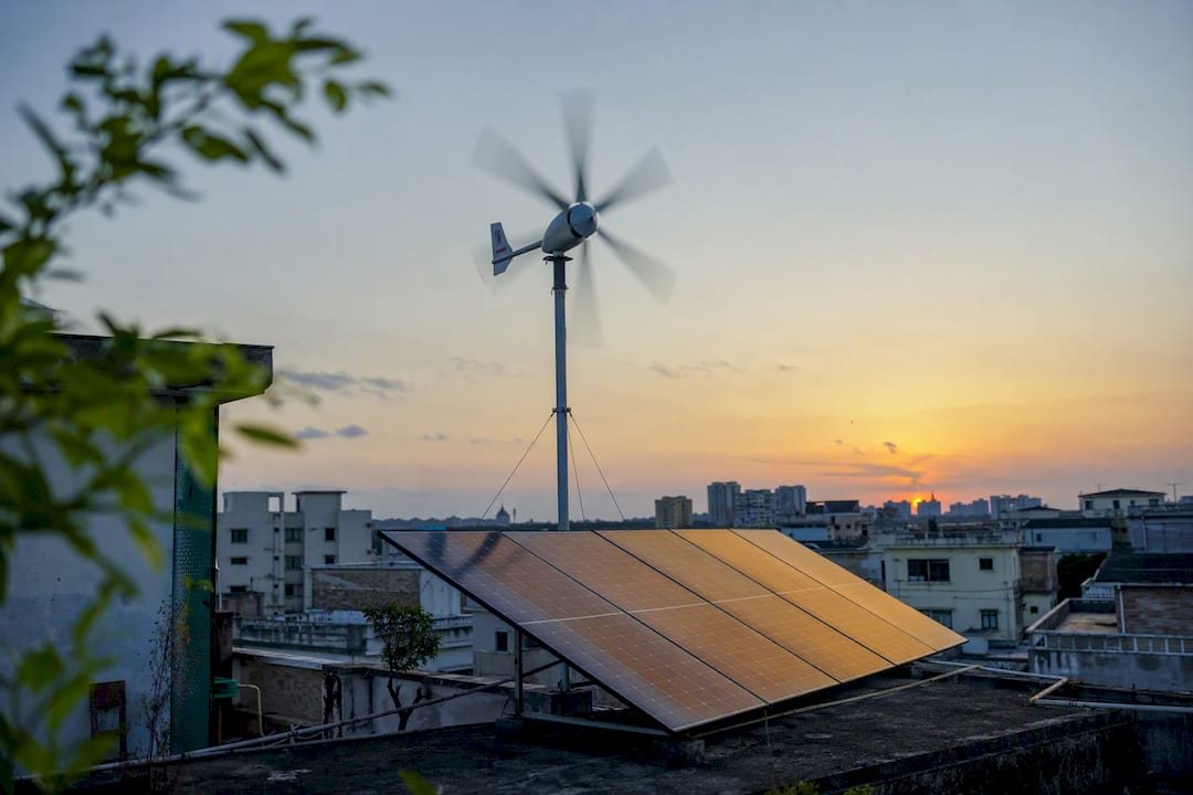 Urban rooftop with small wind turbine and solar panels