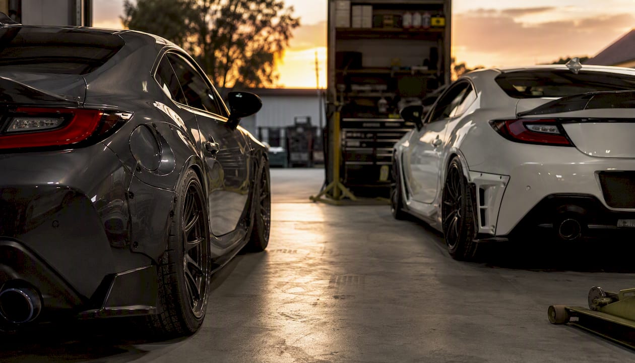Side-by-side Gen-1 and Gen-2 Subaru BRZ in workshop