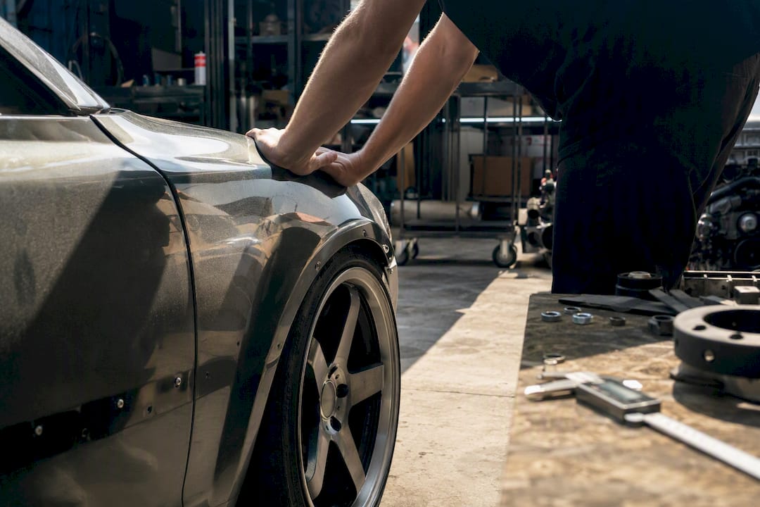 Checking wheel clearance by compressing suspension