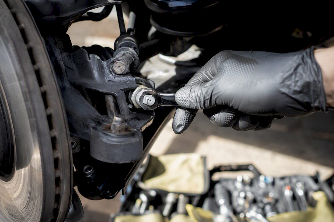 Close view of hand adjusting camber bolt