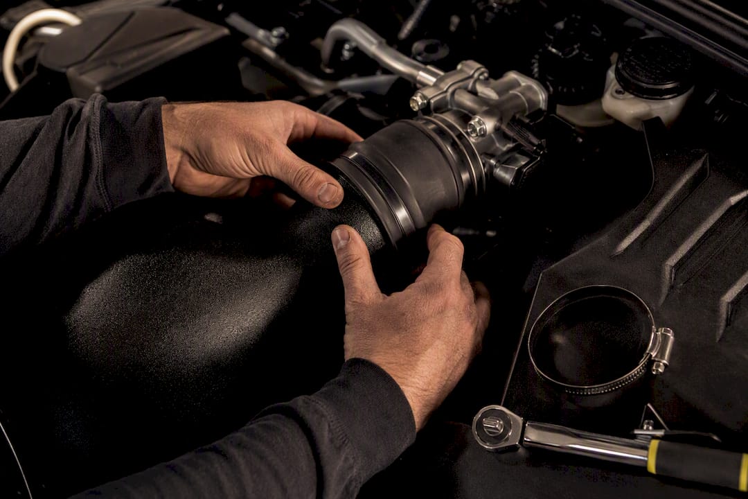 Installer checking intake coupler fitment