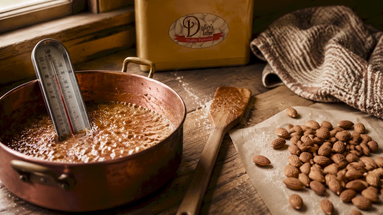 Candy thermometer in saucepan for toffee cooking