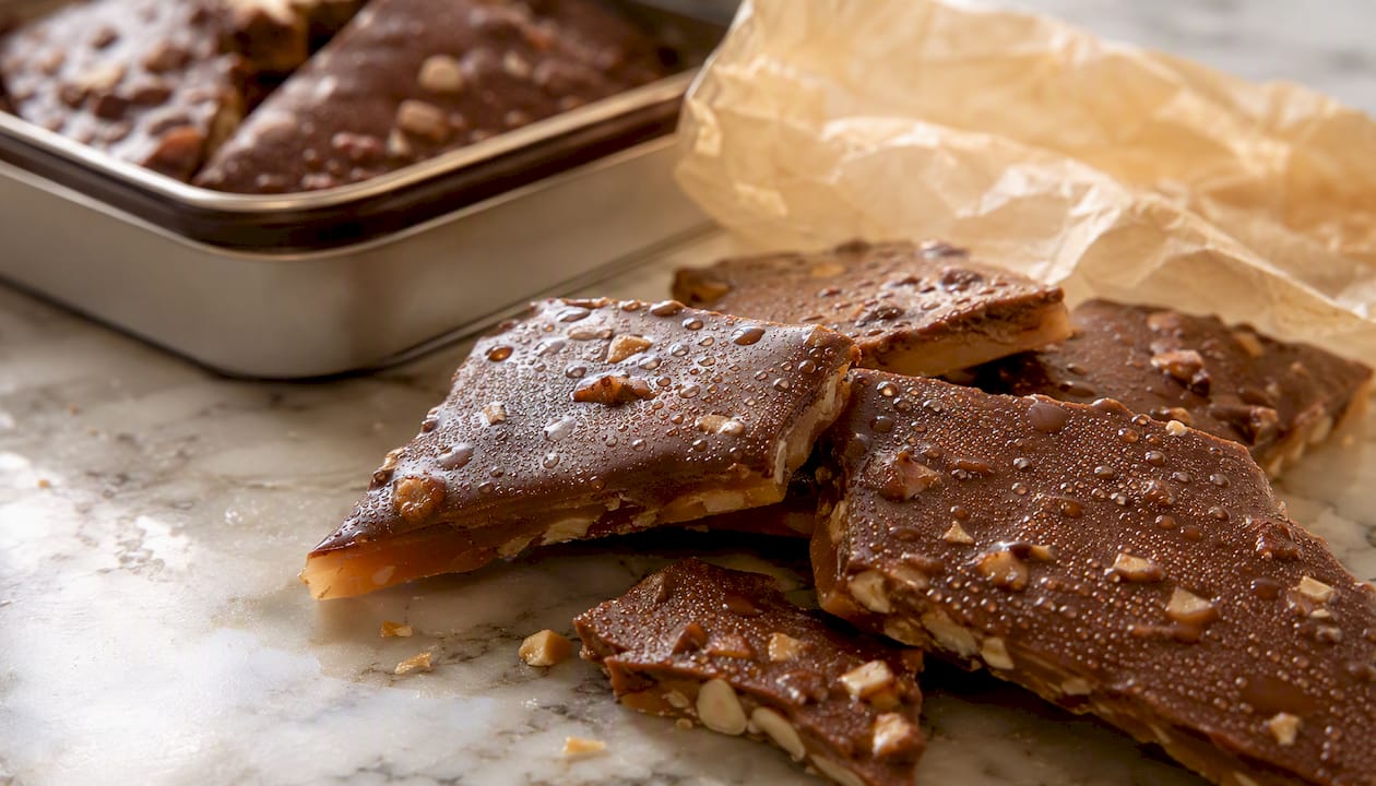 Moisture condensation forming on English almond toffee