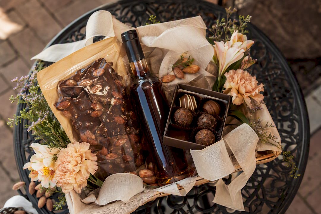 Elegant adult Easter gift basket with toffee and wine