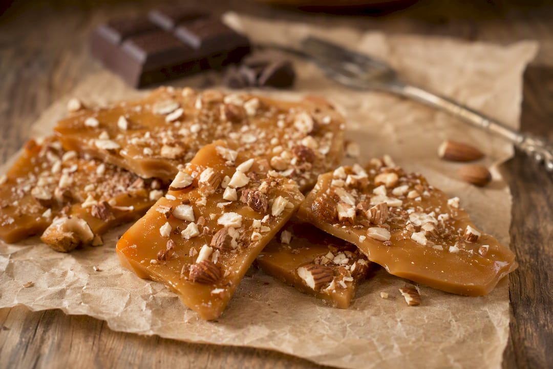 Classic English toffee with almonds on parchment