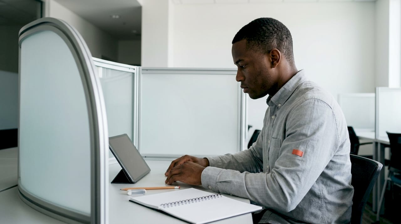 Test taker sitting at digital LSAT test station