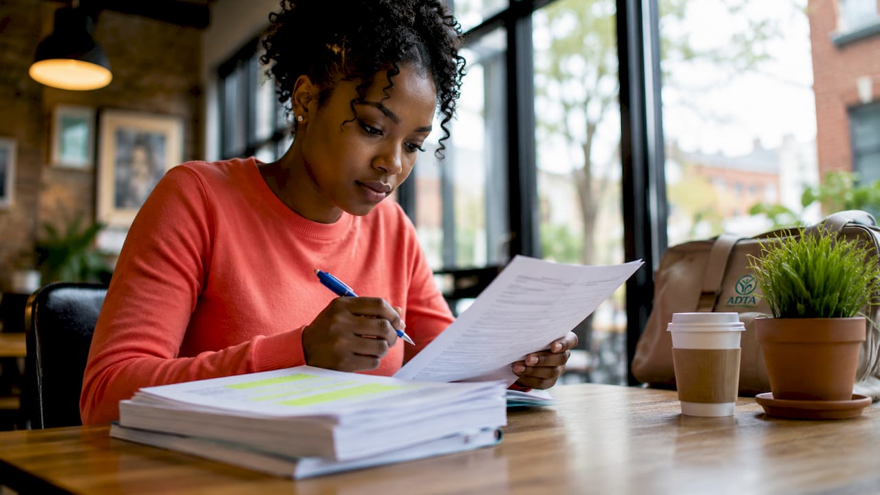 Woman reviewing LSAC disability paperwork