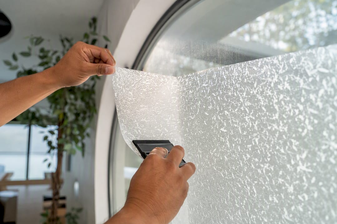 Applying frosted privacy window film on glass