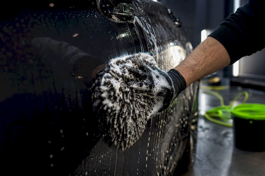 Washing car with microfiber wash mitt