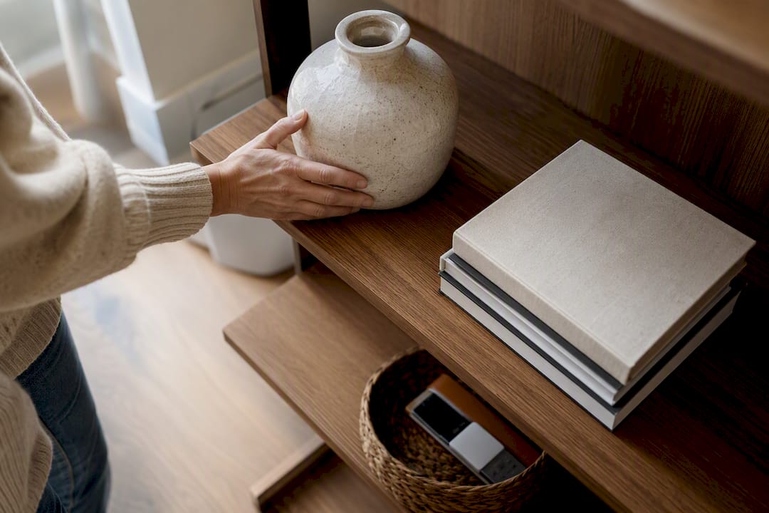 Vase and books styled on open shelving