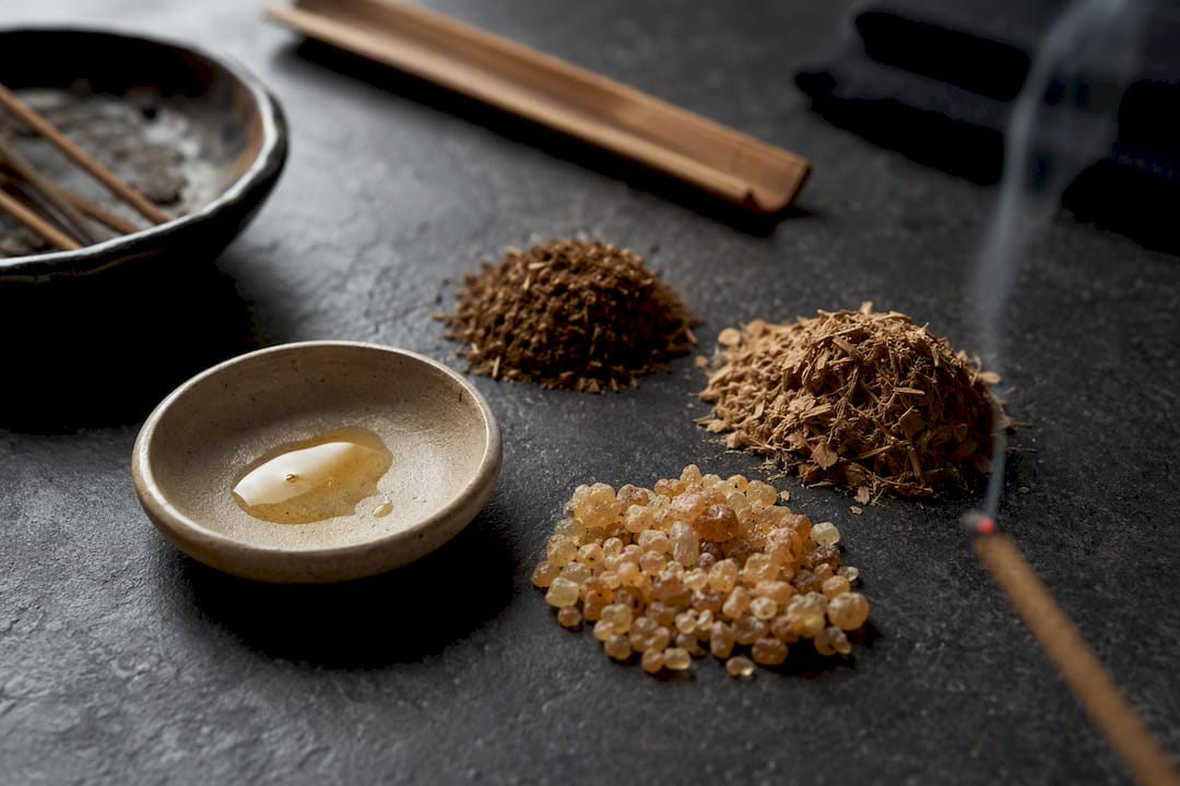 Incense materials beside a smoking stick