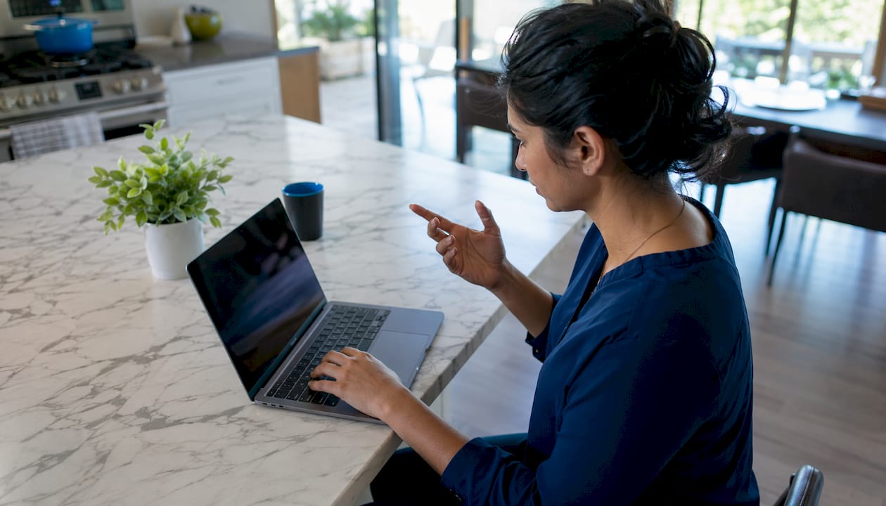 Person reviewing digital vehicle inspection photos on laptop