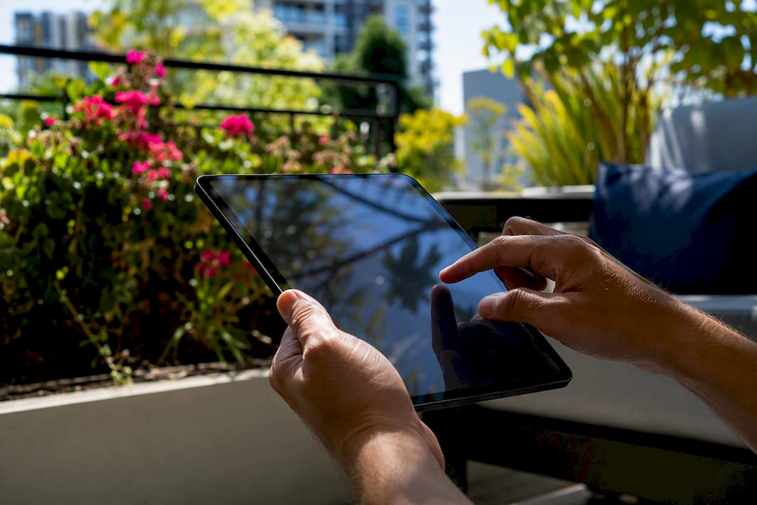 Hands sharing car service documents on tablet