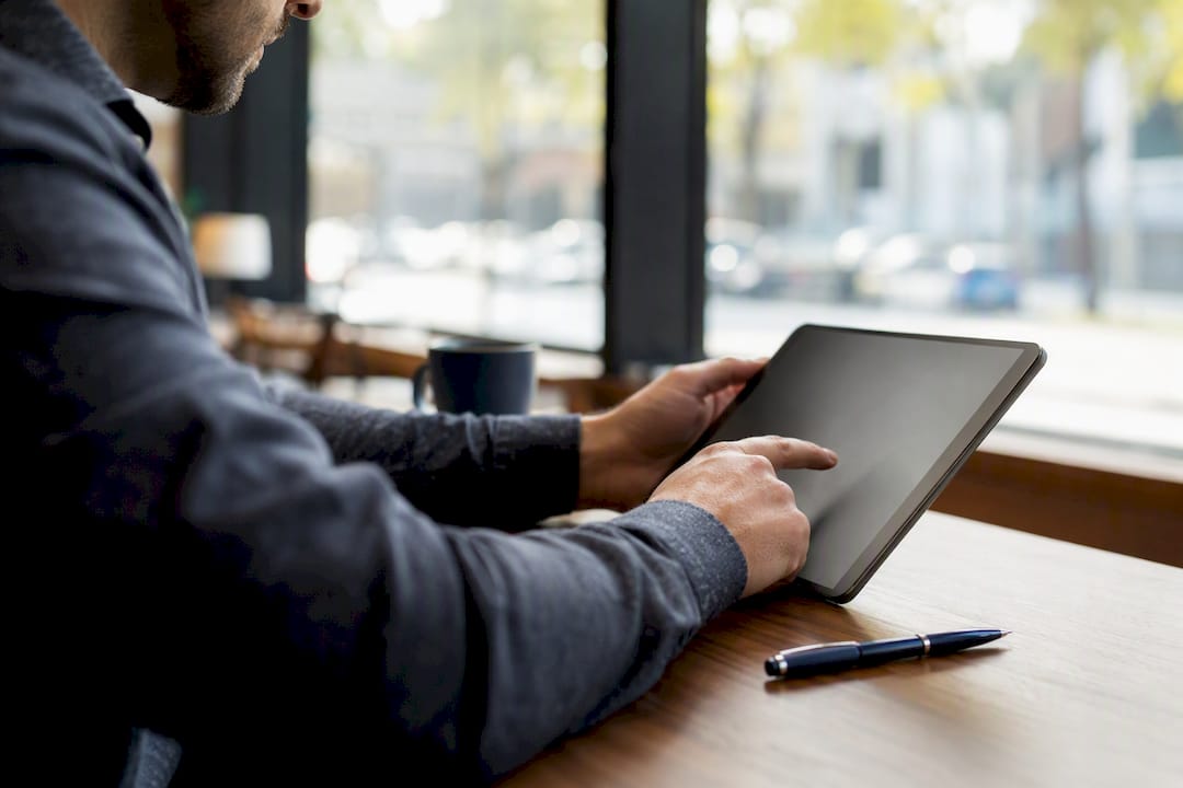 Hands filling out vehicle lien search form