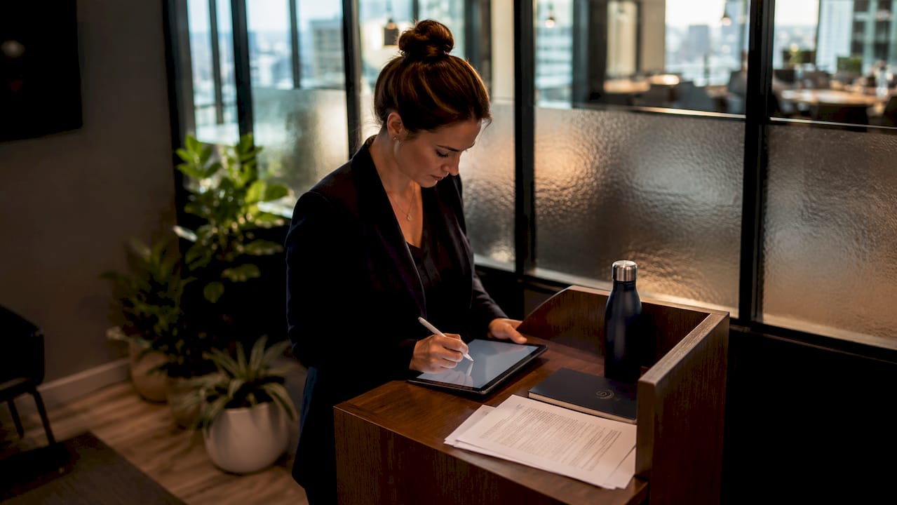 Realtor signing electronic contract on tablet