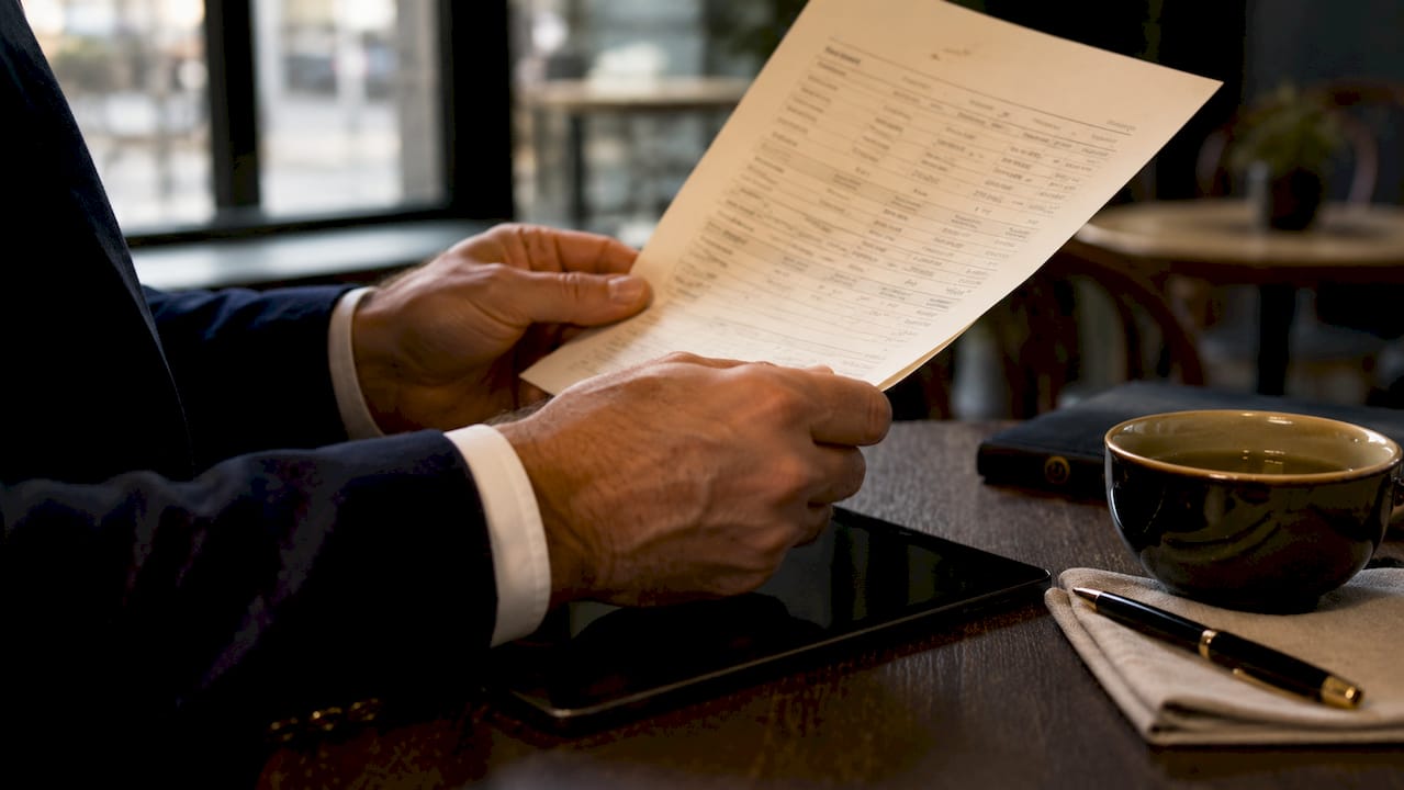 Hands holding electronic signature audit trail document