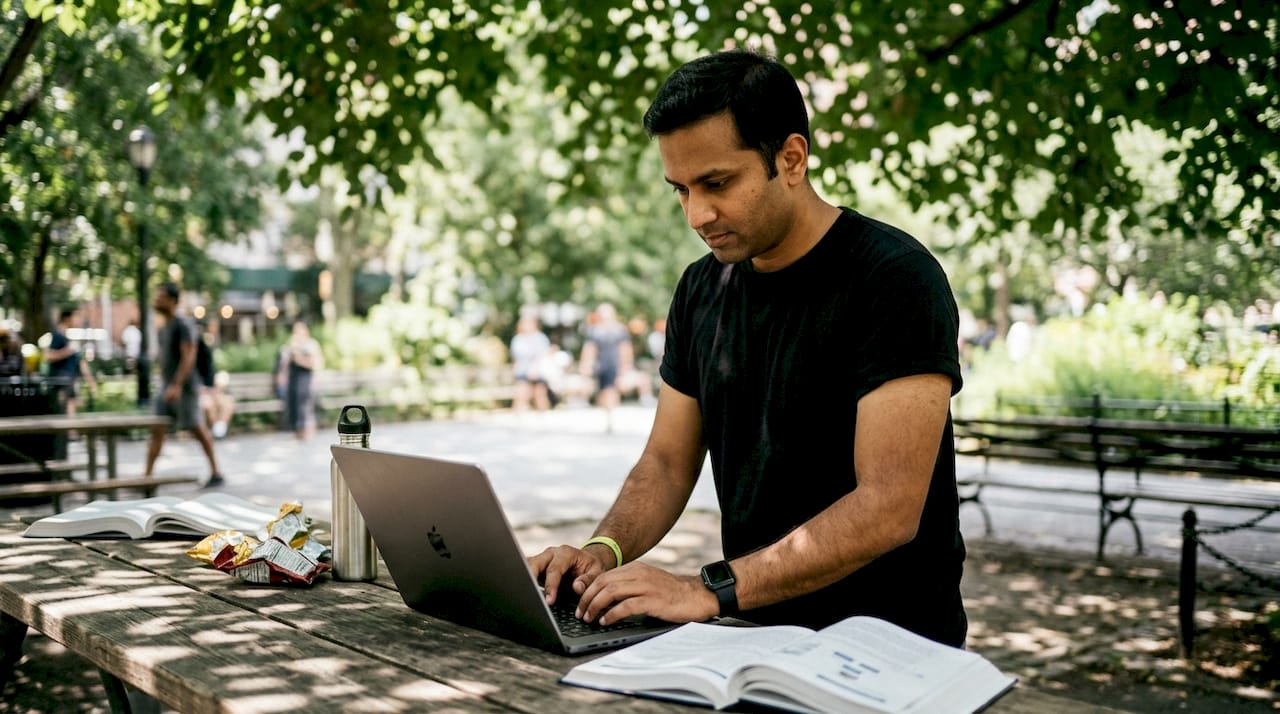 Developer coding at laptop side profile
