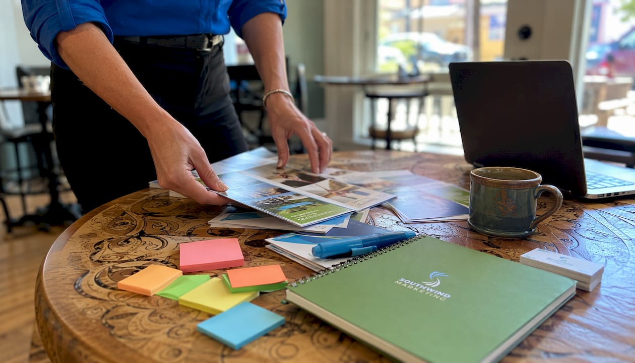 Rural chamber event planning materials on table
